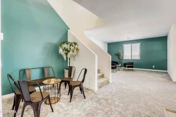 a view of a livingroom with furniture and a potted plant