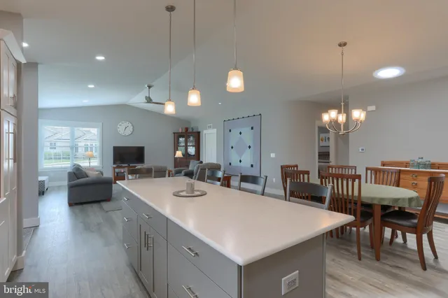 a kitchen with a stove a sink and a refrigerator