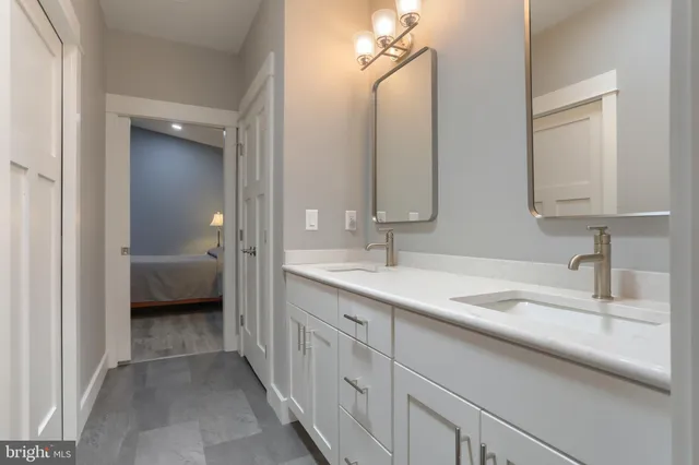 a view of a bathroom from a hallway