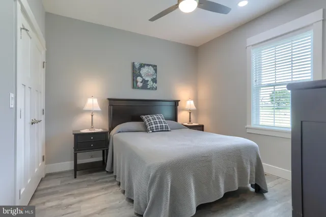 a bedroom with a bed and a lamp