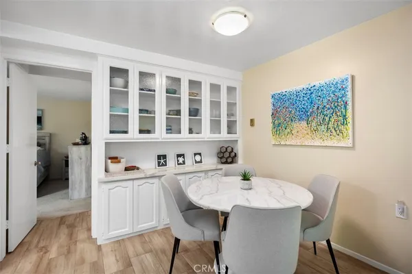 a view of a dining room with furniture and wooden floor