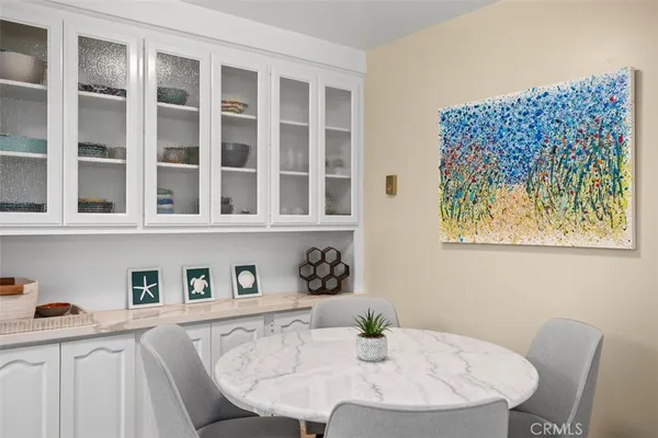 a dining room with a table and chairs