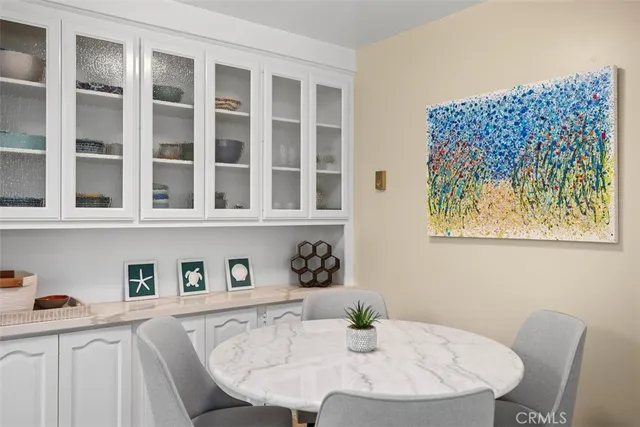 a dining room with a table and chairs