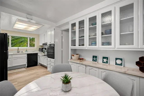 a kitchen with a refrigerator and window
