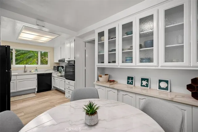 a kitchen with a refrigerator and window