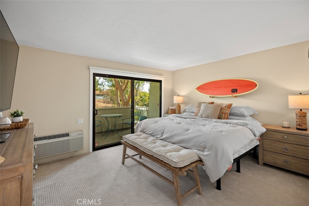 839 Ronda Sevilla, Unit A Laguna Woods, CA 92637 - Photo 26 of 34 a bedroom with a bed and a window