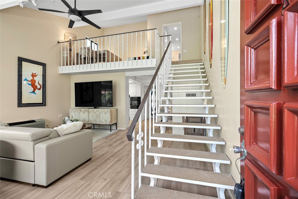 839 Ronda Sevilla, Unit A Laguna Woods, CA 92637 - Photo 6 of 34 a living room with furniture and a flat screen tv