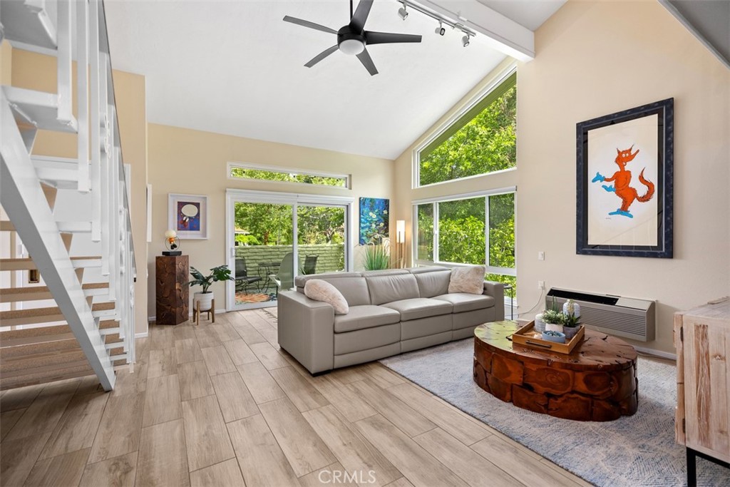 839 Ronda Sevilla, Unit A Laguna Woods, CA 92637 - Photo 8 of 34 a living room with furniture and a large window