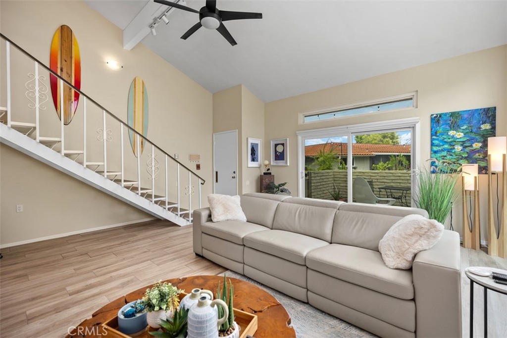 839 Ronda Sevilla, Unit A Laguna Woods, CA 92637 - Photo 9 of 34 a living room with furniture and a large window