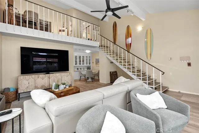 a living room with furniture fireplace and a flat screen tv