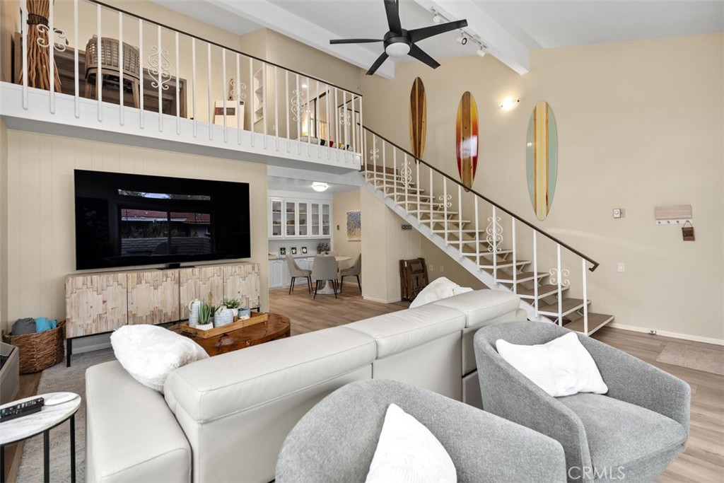 839 Ronda Sevilla, Unit A Laguna Woods, CA 92637 - Photo 10 of 34 a living room with furniture fireplace and a flat screen tv