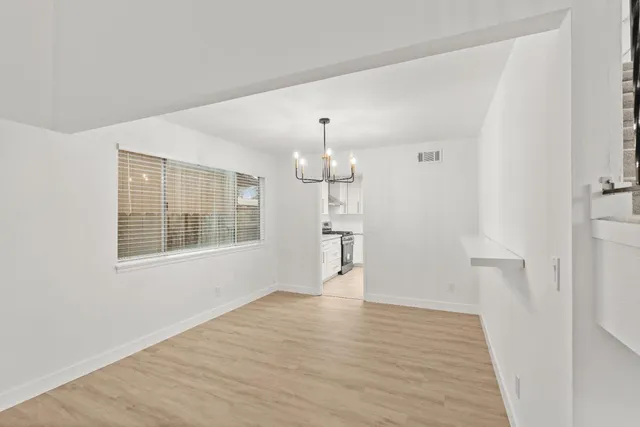 a kitchen with stainless steel appliances a refrigerator sink and cabinets