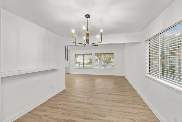 a kitchen with a refrigerator sink and stove