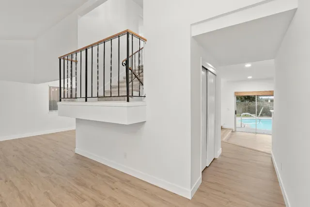 a kitchen with stainless steel appliances a sink dishwasher stove and refrigerator