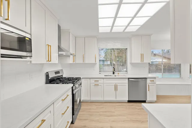 a view of a livingroom with furniture and a fireplace