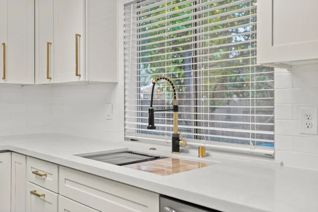 a view of a hallway with washer and dryer