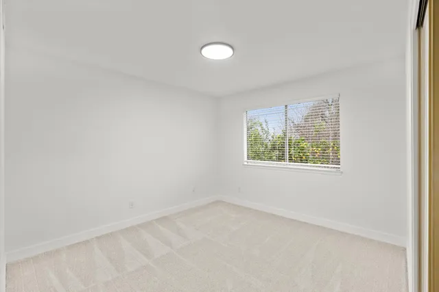 a backyard of a house with yard and outdoor seating