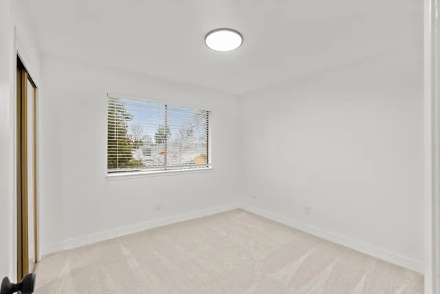 an aerial view of a residential houses with outdoor space