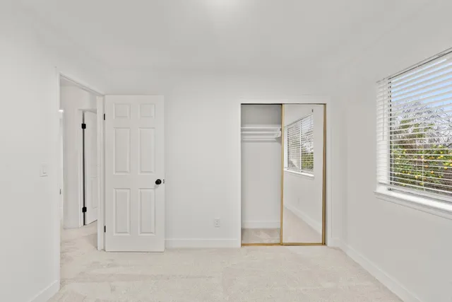 an aerial view of a house with a swimming pool