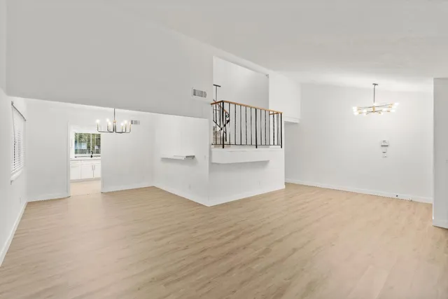 a view of gallery with wooden floor