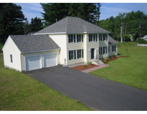Lot 1 Harbor Trace Road Townsend, MA 01469 - Photo 1 of 6 a front view of a house with a garden