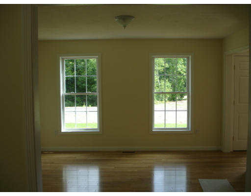 Lot 1 Harbor Trace Road Townsend, MA 01469 - Photo 5 of 6 a view of an empty room with wooden floor and a window