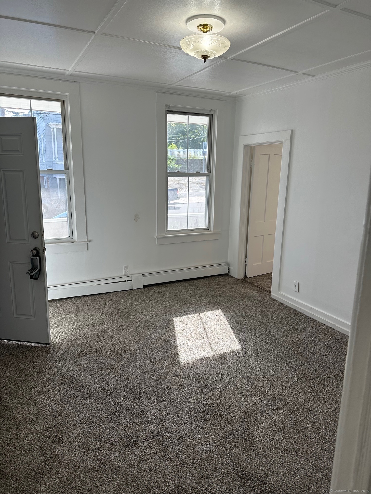 23 Ward Street, Unit 1 Vernon, CT 06066 - Photo 2 of 8 an empty room with windows