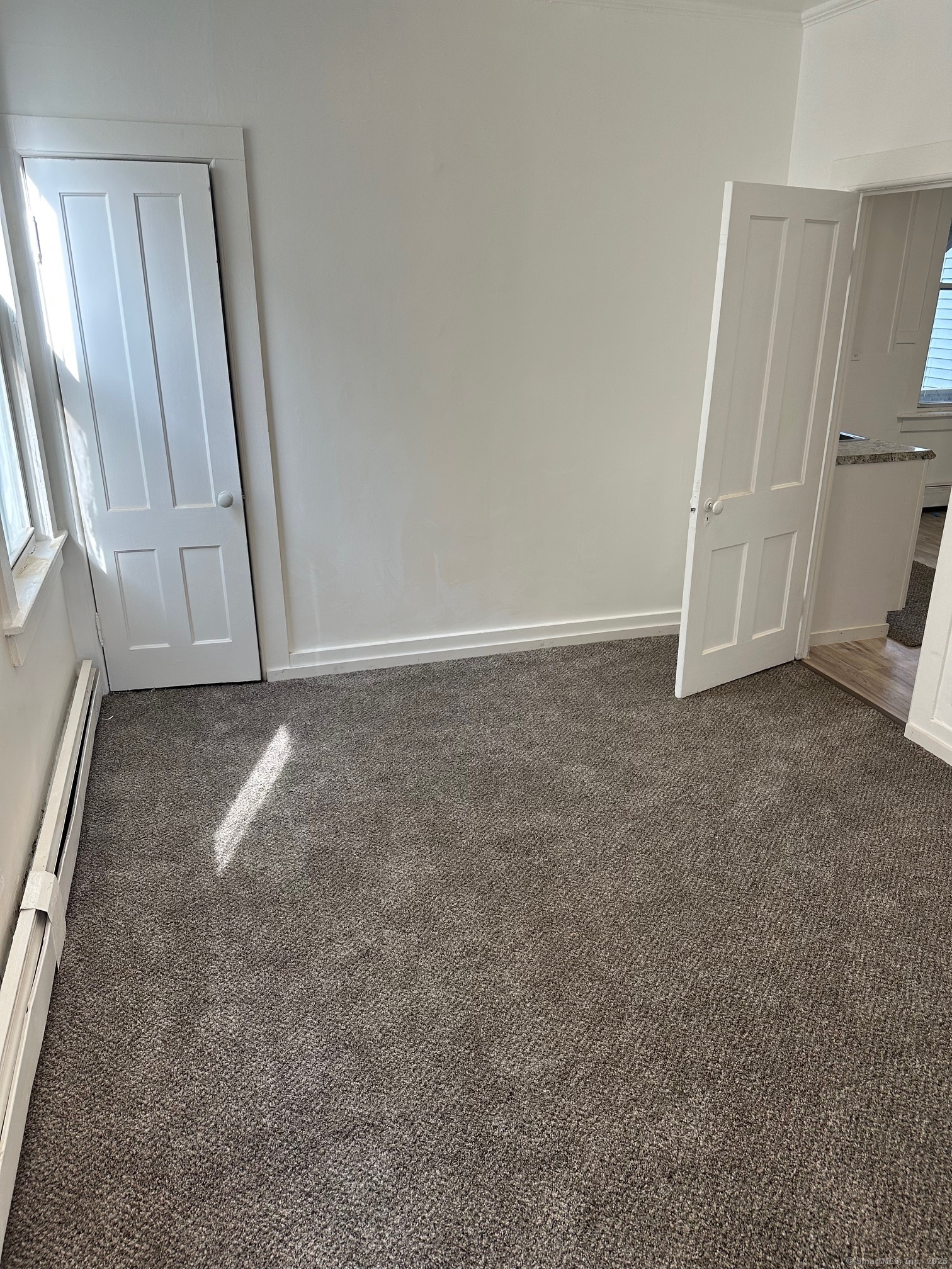 23 Ward Street, Unit 1 Vernon, CT 06066 - Photo 3 of 8 an empty room with windows