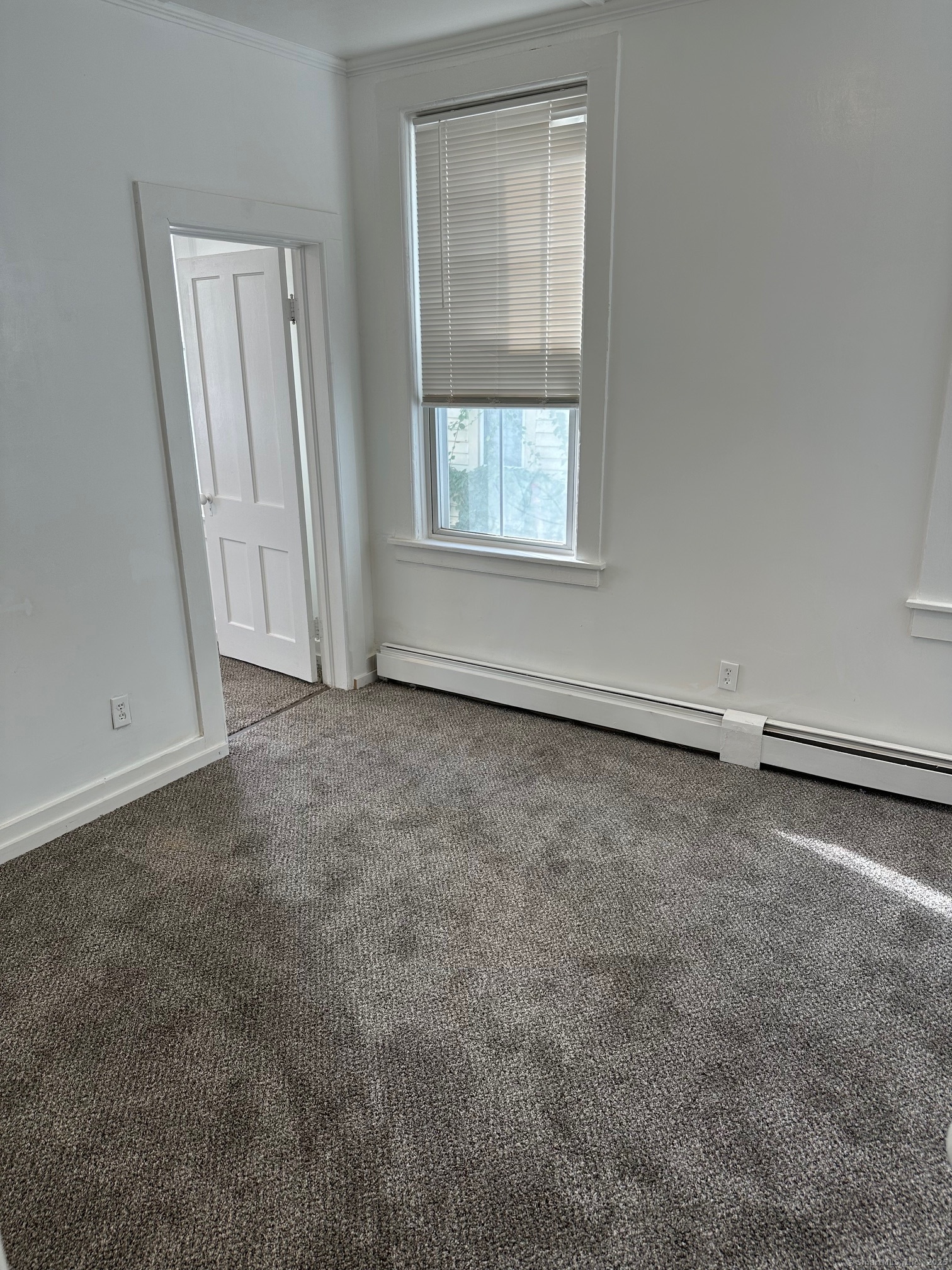 23 Ward Street, Unit 1 Vernon, CT 06066 - Photo 4 of 8 an empty room with a window