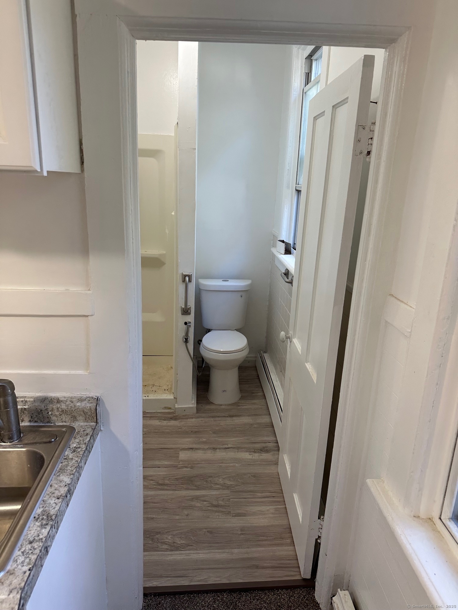 23 Ward Street, Unit 1 Vernon, CT 06066 - Photo 5 of 8 a bathroom with a granite countertop sink toilet and shower