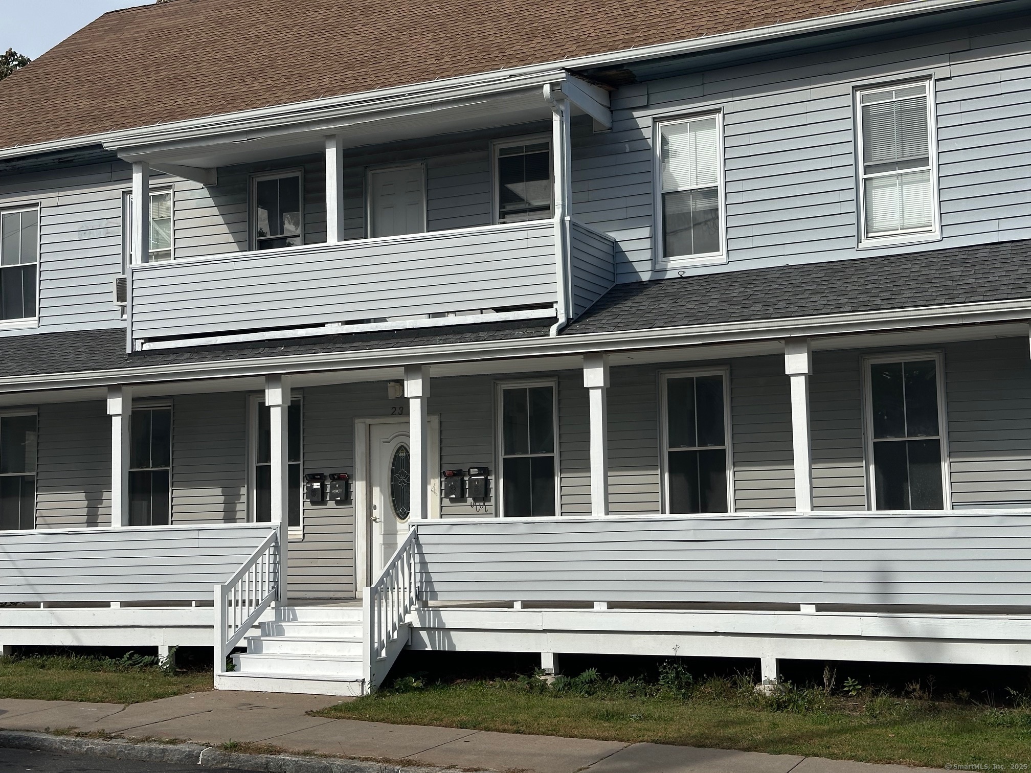 23 Ward Street, Unit 1 Vernon, CT 06066 - Photo 8 of 8 a view of a house and that has a bed and stairs