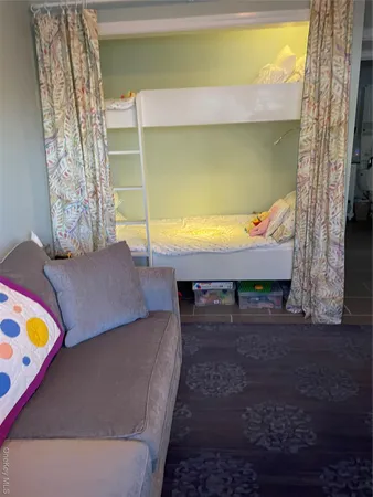 a living room with fireplace furniture and a flat screen tv