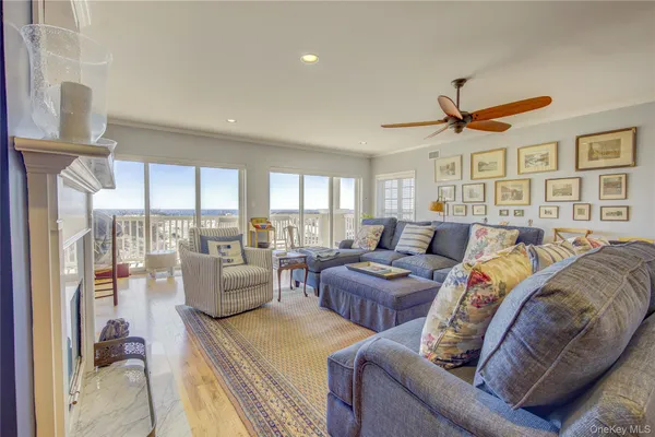 a living room with furniture a rug and a fireplace