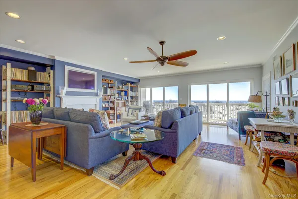 a living room with furniture fireplace and rug