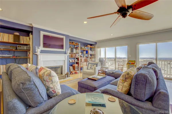 a view of a dining room kitchen with stainless steel appliances granite countertop a table and chairs in it
