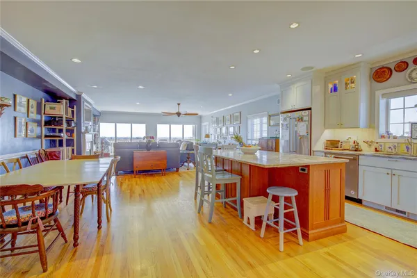 a living room with fireplace furniture and a wooden floor