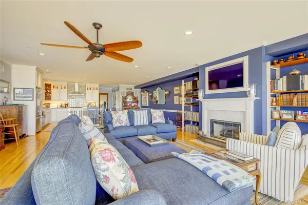 a living room with furniture fireplace and a flat screen tv