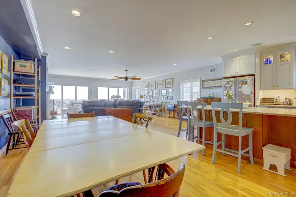 a view of a large building with a big yard and potted plants