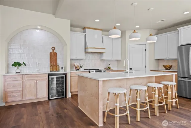 a kitchen with granite countertop a sink and a stove