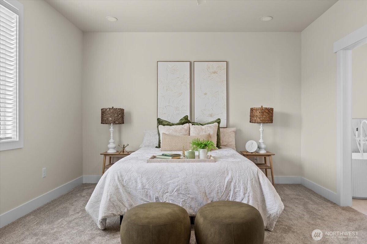 1040 South Florida Place Kennewick, WA 99338 - Photo 20 of 33 a bed sitting in a bedroom next to a window with a lamp