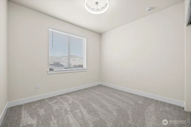 an empty room with wooden floor