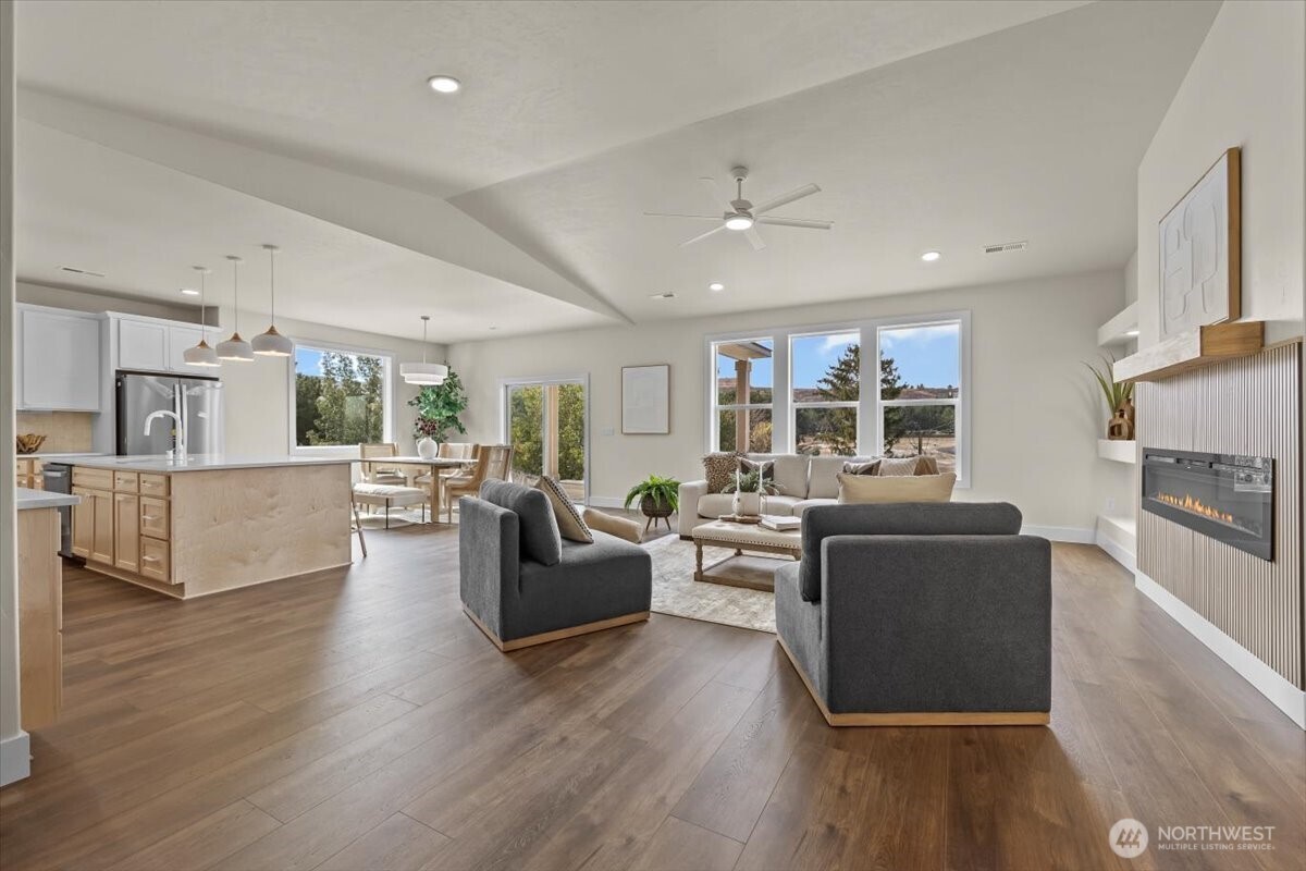 1040 South Florida Place Kennewick, WA 99338 - Photo 5 of 33 a living room with fireplace furniture and a wooden floor