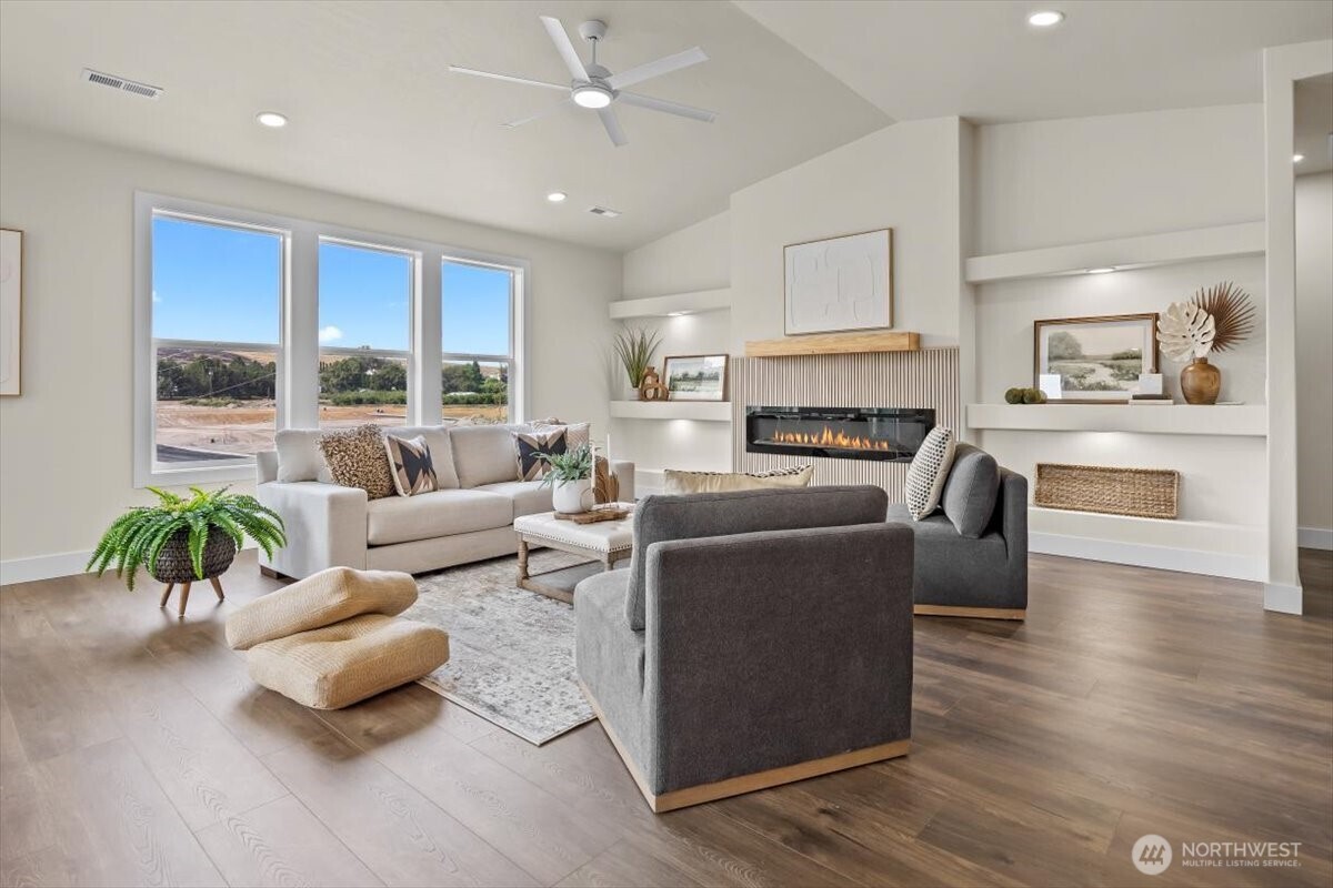 1040 South Florida Place Kennewick, WA 99338 - Photo 6 of 33 a living room with furniture fireplace and a large window