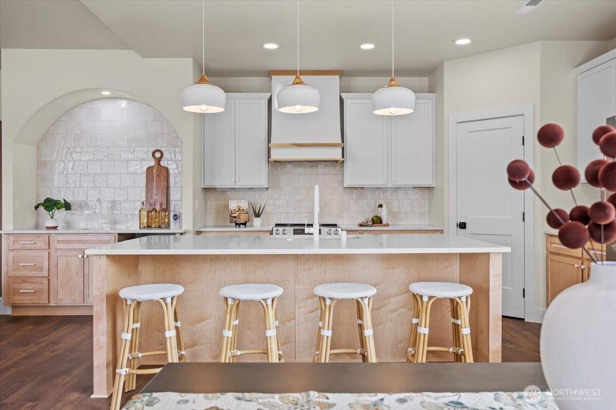 1040 South Florida Place Kennewick, WA 99338 - Photo 10 of 33 a large white kitchen with a sink and cabinets