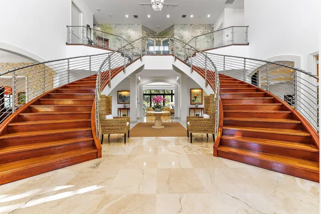 a living room with lots of furniture and a table