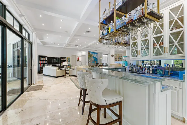 a spacious bedroom with a balcony a bed and wooden floor