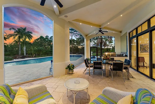a balcony with furniture and a potted plant