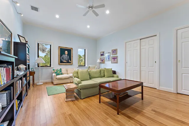 a bathroom with a granite countertop sink mirror and a bath tub