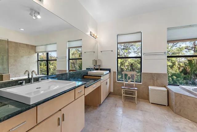 a view of a swimming pool with a yard