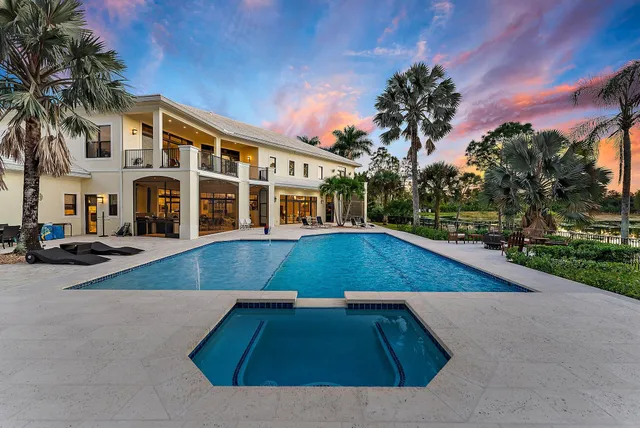 a bathroom with a sink mirror and vanity